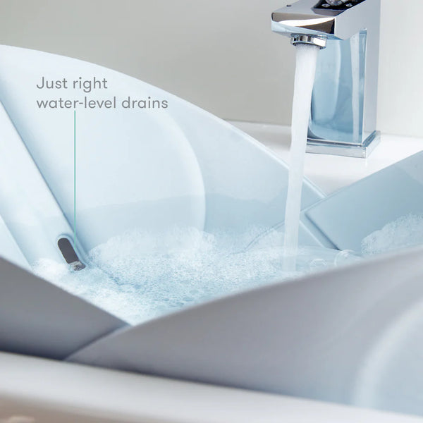 Frida Baby Soft Sink Bath, Sink Bather, Easy to Clean Bather That Supports Baby's Head