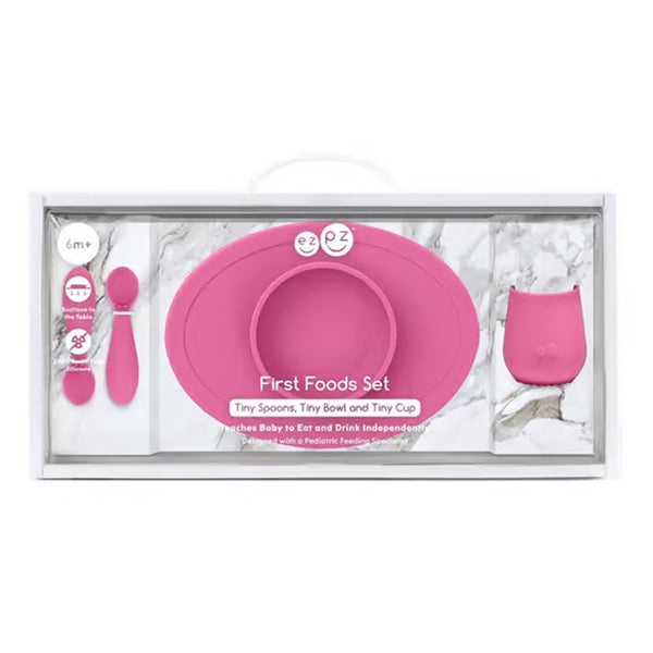 EzPz First Foods Set 100% Food Grade Silicone Baby & Toddler Suction Bowl with Built In Placemat - Pink