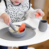 EzPz First Foods Set 100% Food Grade Silicone Baby & Toddler Suction Bowl with Built In Placemat - Grey