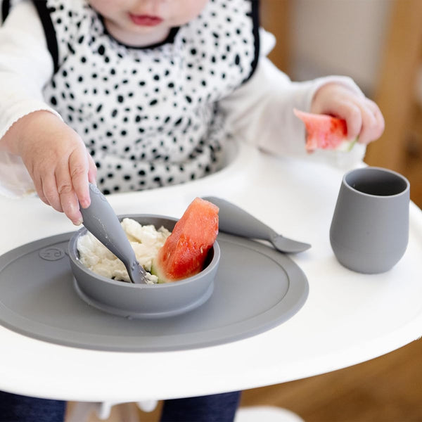 EzPz First Foods Set 100% Food Grade Silicone Baby & Toddler Suction Bowl with Built In Placemat - Grey