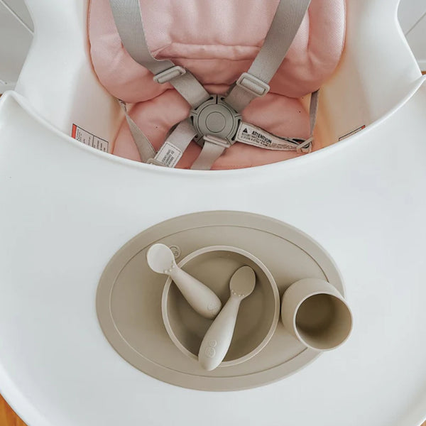 EzPz First Foods Set 100% Food Grade Silicone Baby & Toddler Suction Bowl with Built In Placemat - Oat