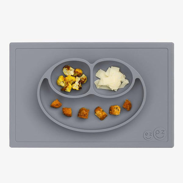 Ezpz Happy Mat 100% Food Grade Silicone Toddler Suction Plate with Built In Placemat, Smile Design Divided Plate - Grey
